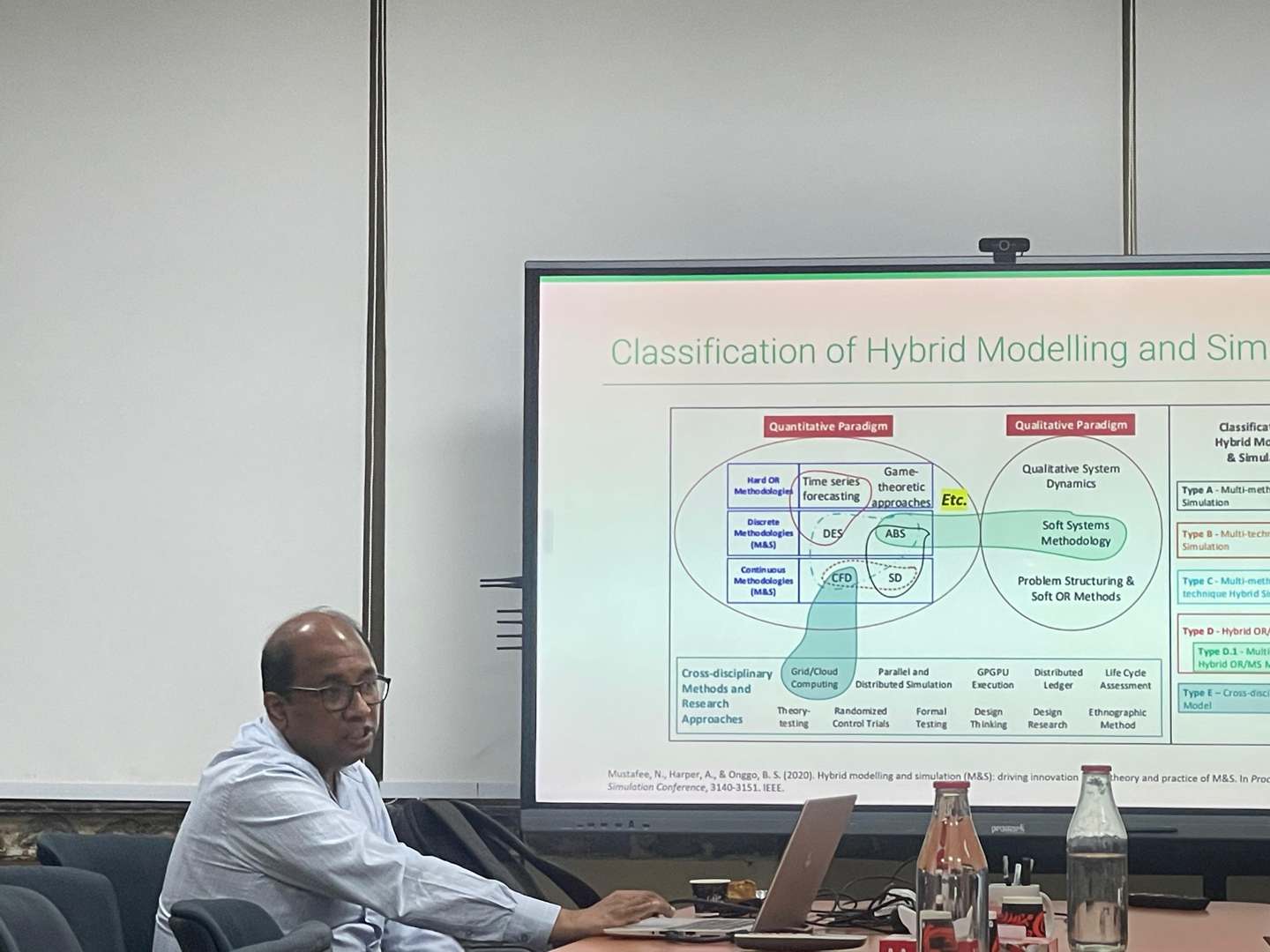 Dr. Boli Chen discussing his research with attendees